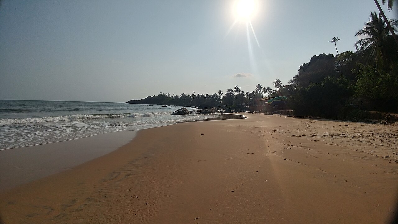 Patnem Beach in Goa with coastline and open sky.
