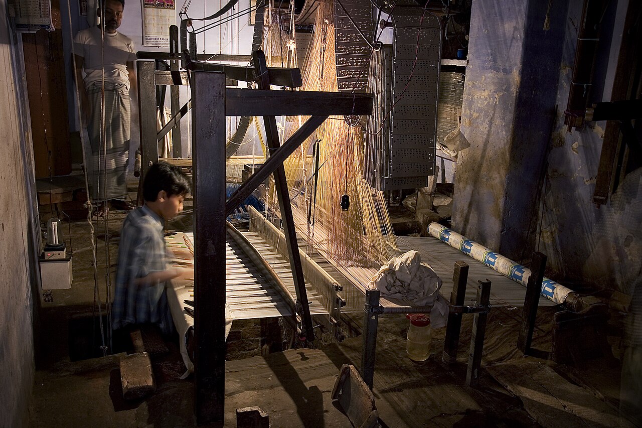 Indian craft production detail used as a placeholder for furniture craftsmanship.